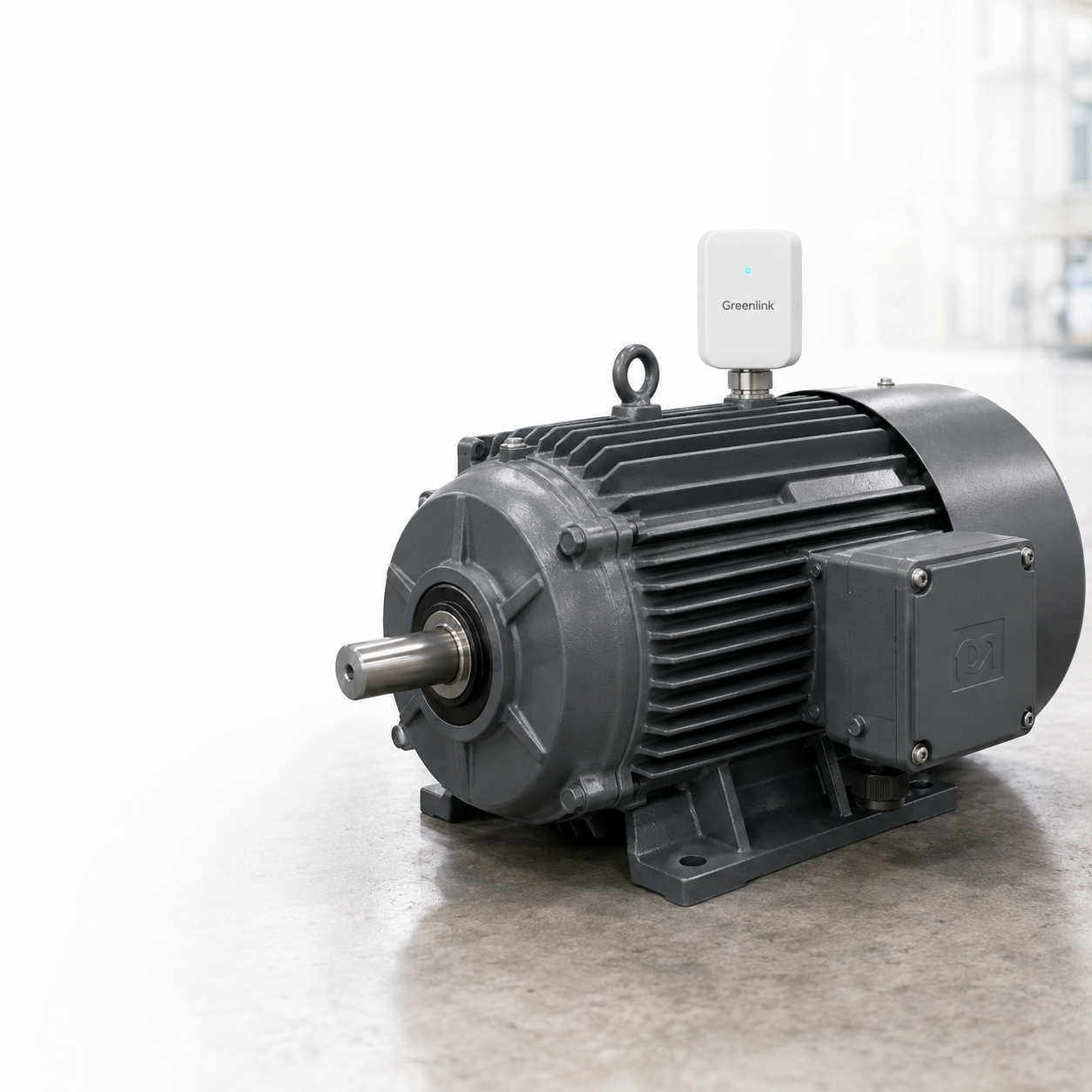 Industrial motor with a conceptual Greenlink condition-monitoring sensor mounted on top