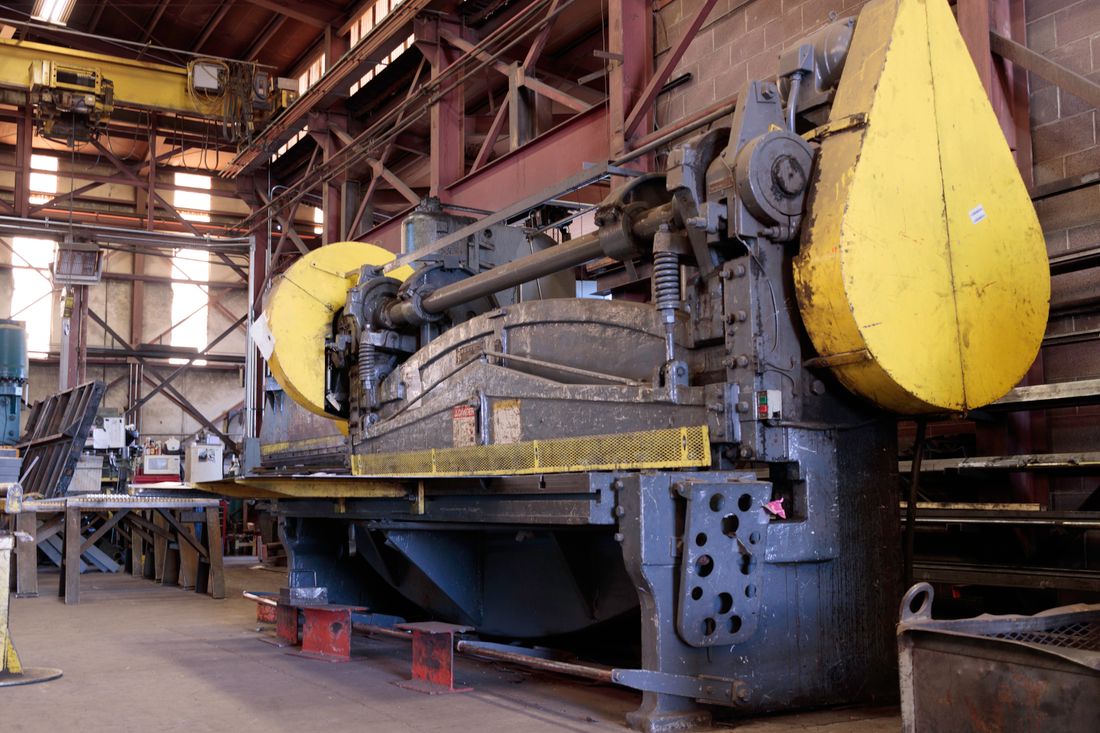 Heavy industrial machinery on a manufacturing floor.